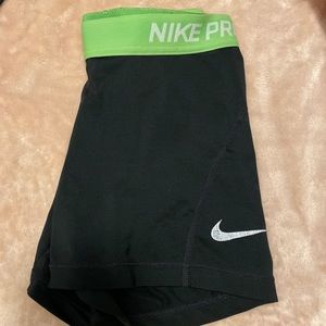 Neon green band Nike pro shorts